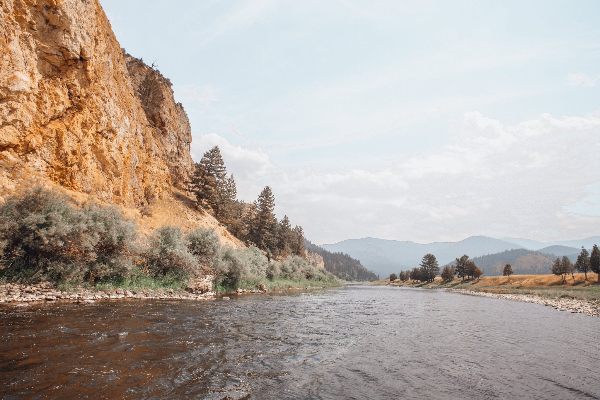 The renowned Big Hole River meanders across the vast Montana wilderness in this elegant fine art photograph by Jules Frazier.