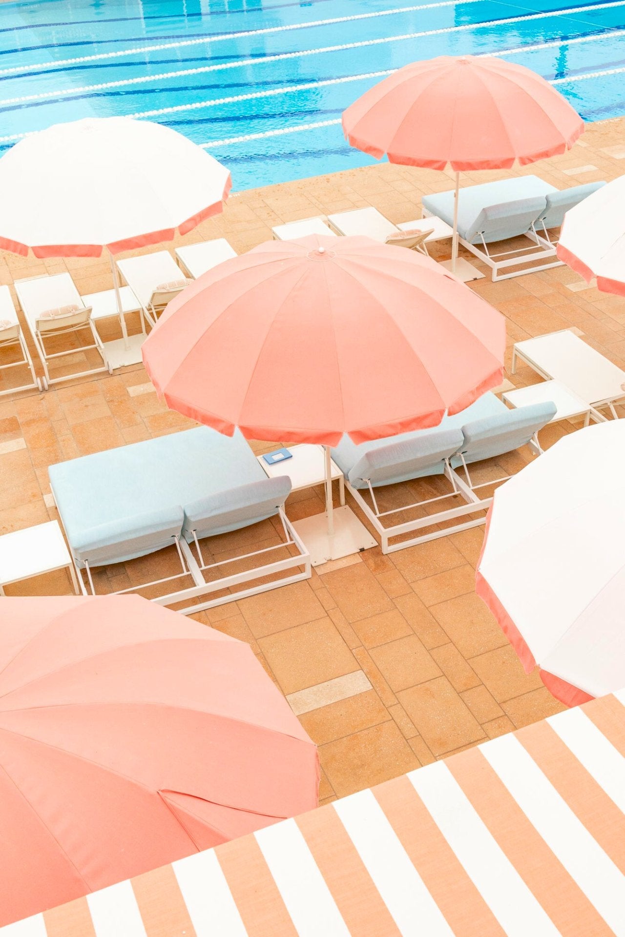 Infamous Coral Casino beach club with vintage umbrellas. A retro-chic fine art photograph by Jules Frazier.