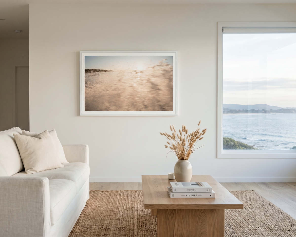 Abstract water image of a wave-Living room with a white sofa, wooden coffee table, and framed artwork on the wall.