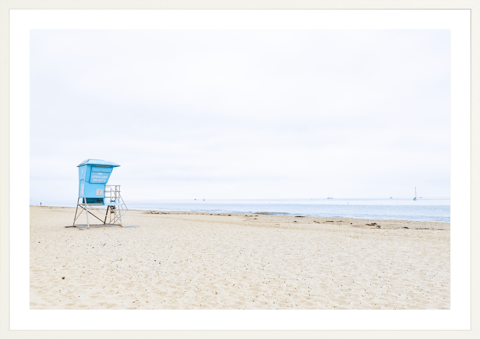 No Lifeguard on Duty by Jules Frazier. A coastal fine art print, minimal, beach culture. white frame.
