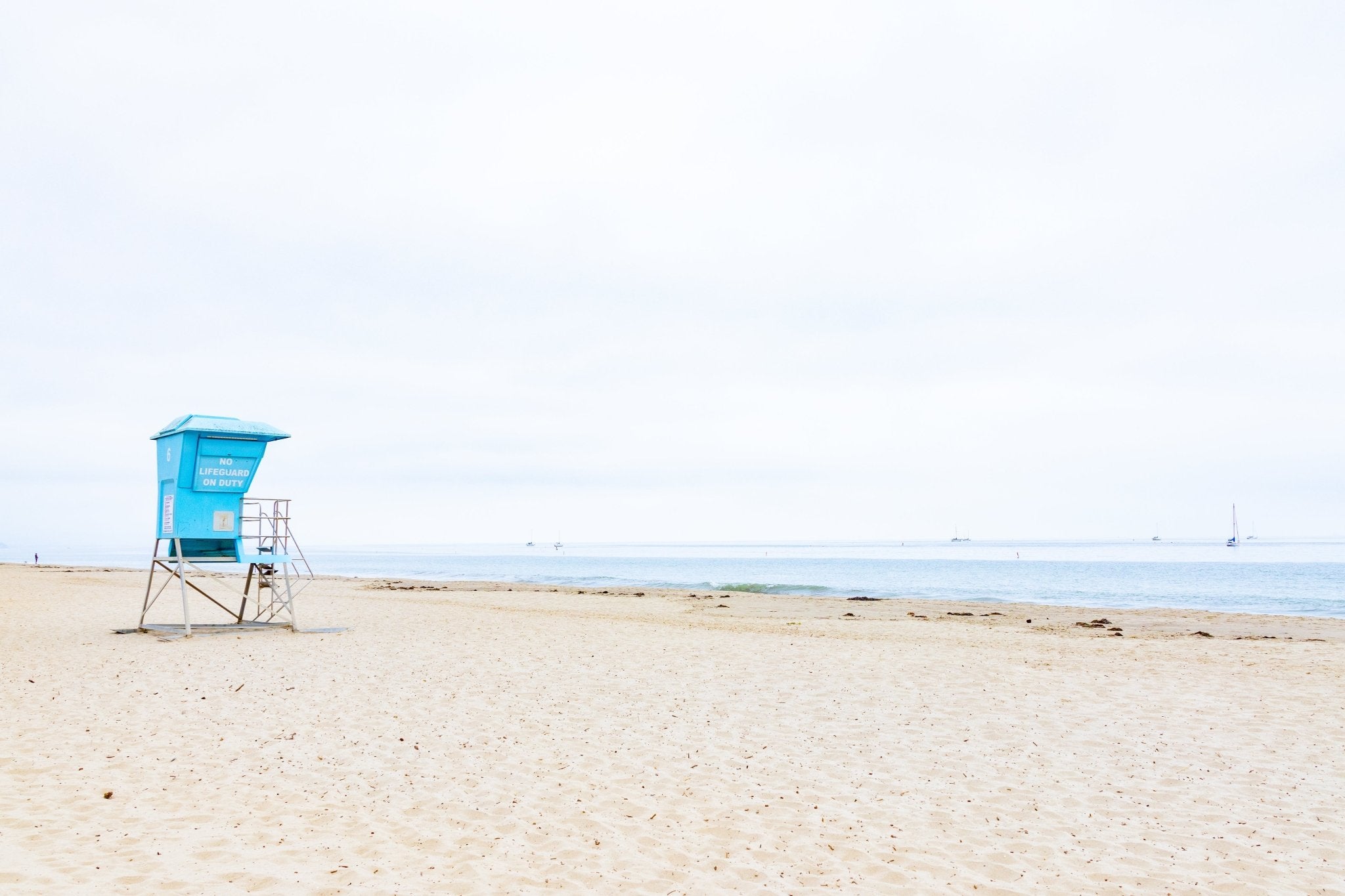 No Lifeguard on Duty by Jules Frazier. A coastal fine art print, minimal, capturing the relaxed spirit of beach culture.