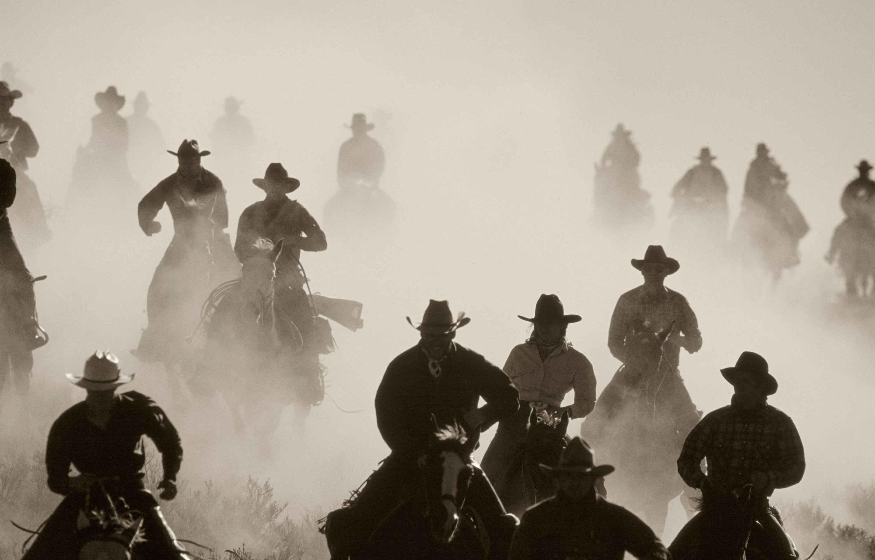 Posse, a group of horseback riders in the dust by Jules Frazier fine art photographer