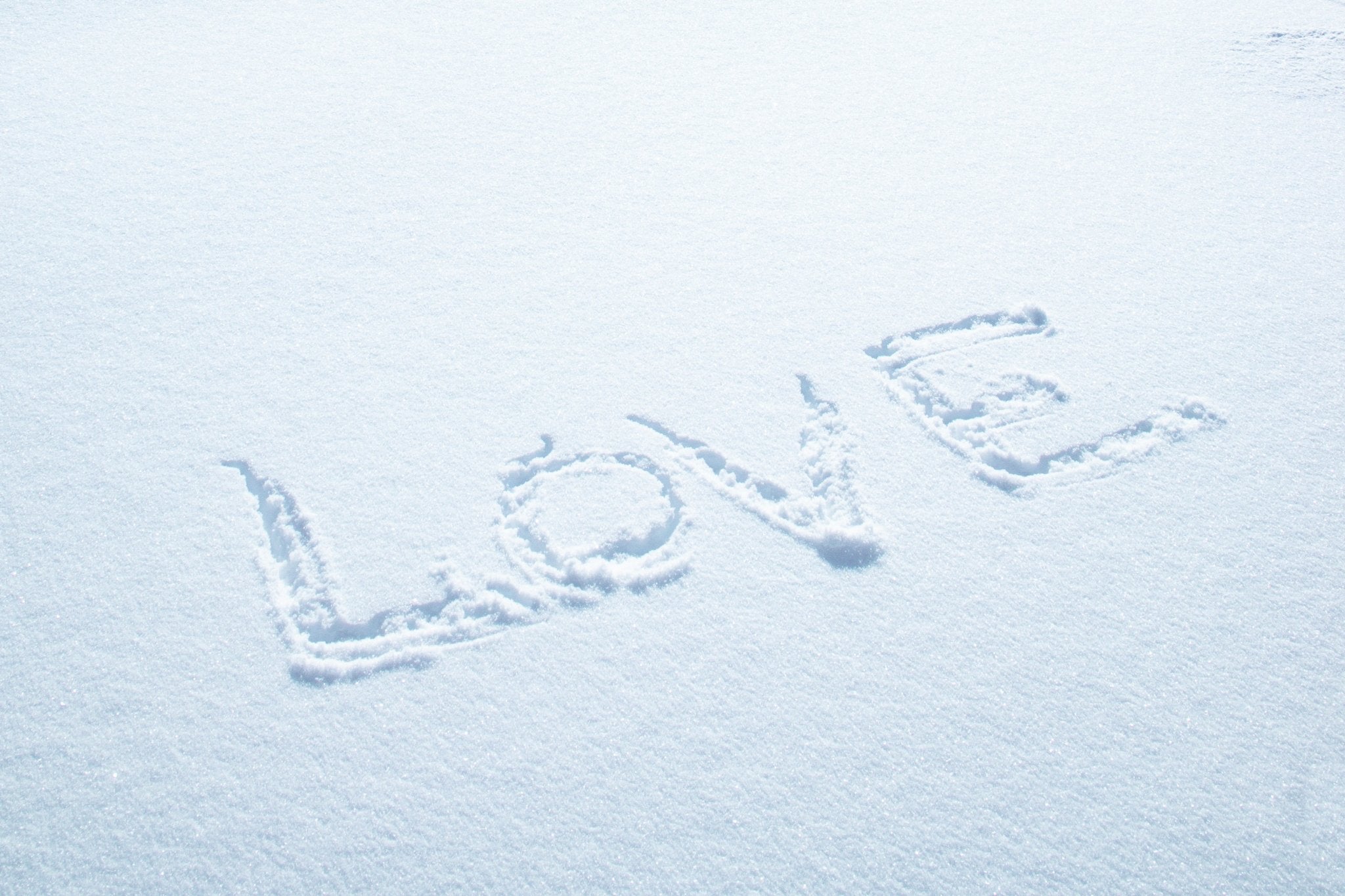 Snow Love by Jules Frazier. “LOVE” drawn into fresh powder—playful, chic fine art print celebrating joy.