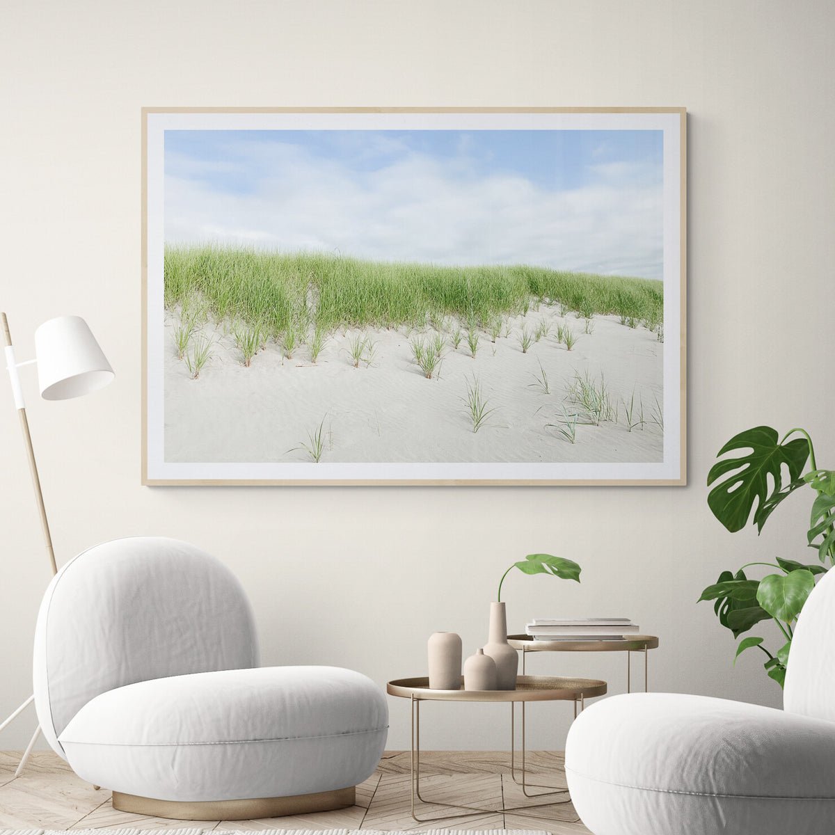 Beach Dunes, Oregon fine art print in a natural wood frame above two chairs, by Jules Frazier