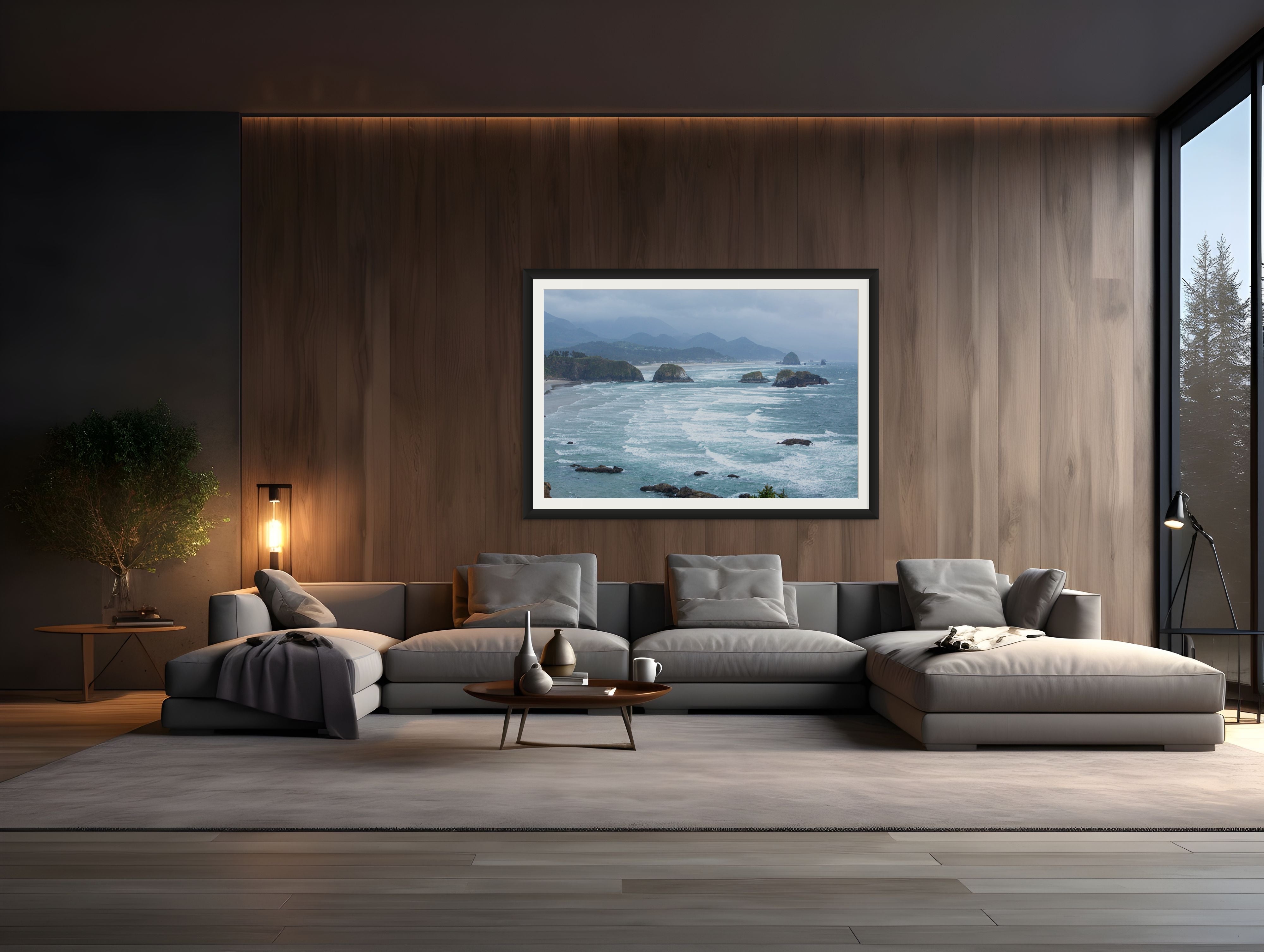 Modern living room with a gray sectional sofa, coffee table, and framed picture on the wall.