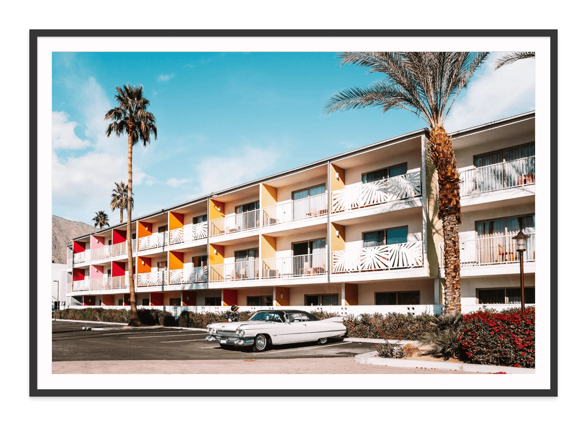 Guitars and Cadillacs, Palm Springs, California fine art print in a black frame with white mat, by Jules Frazier.