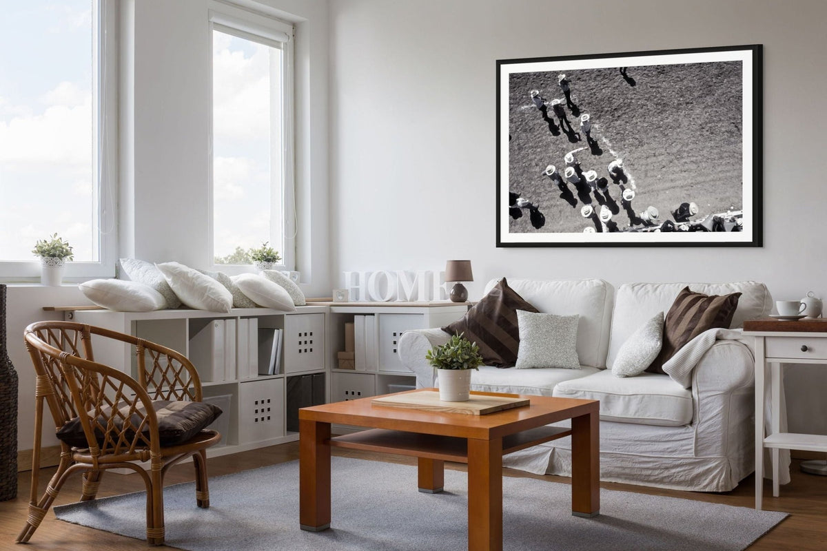 Seventeen Cowboy Hats-Pendleton Round-Up fine art print in a black frame above a white sofa, by Jules Frazier