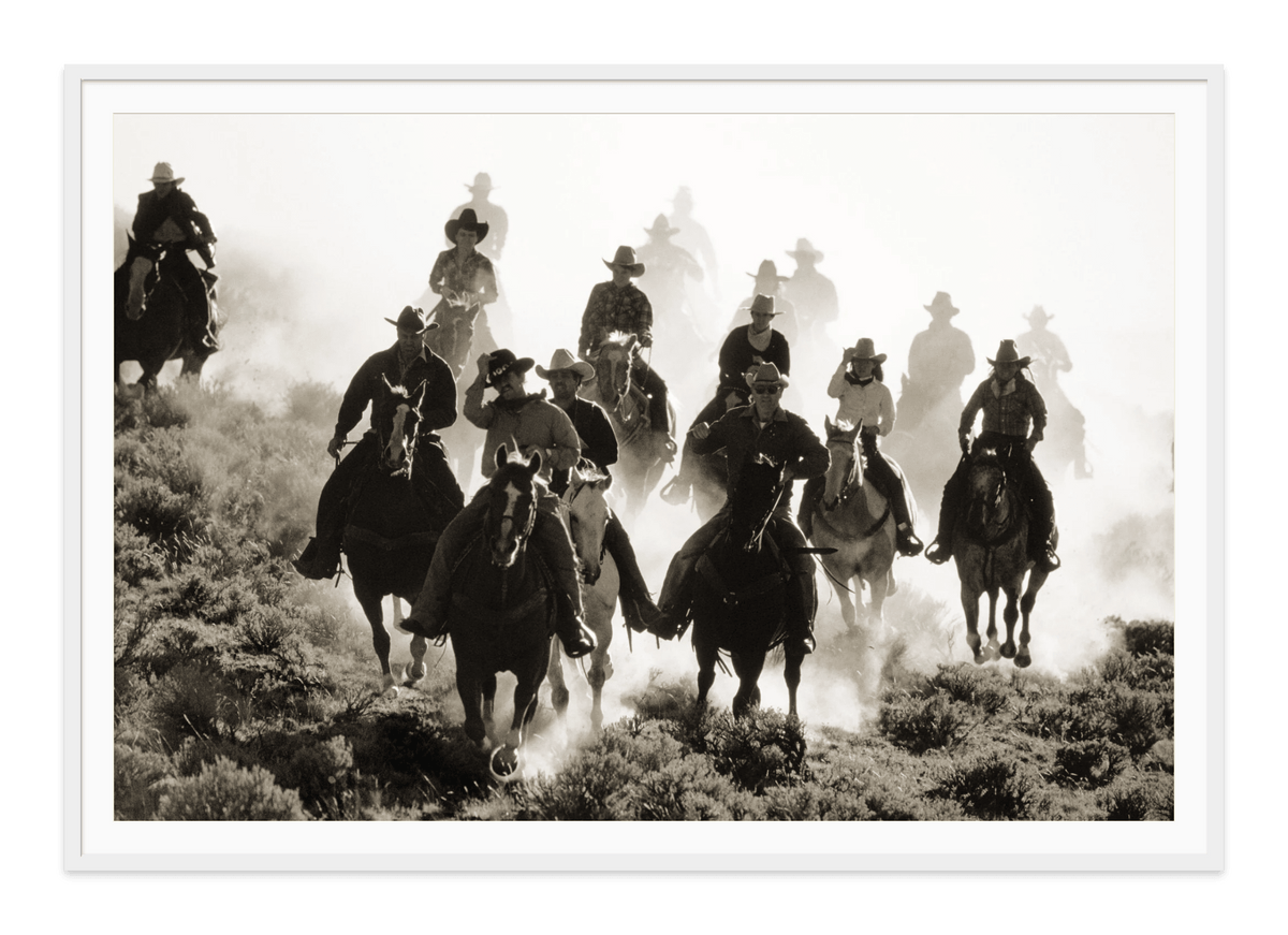 Wranglers fine art print in a white frame with white mat, by Jules Frazier.