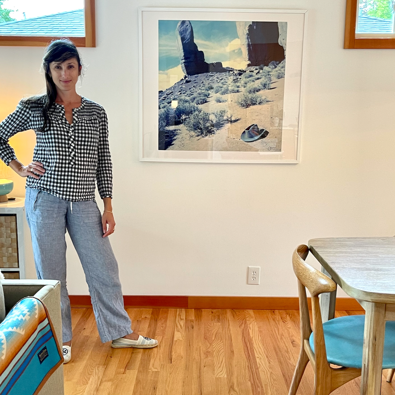 Happy customer with framed print from Jules Frazier,  "Hat on desert floor"