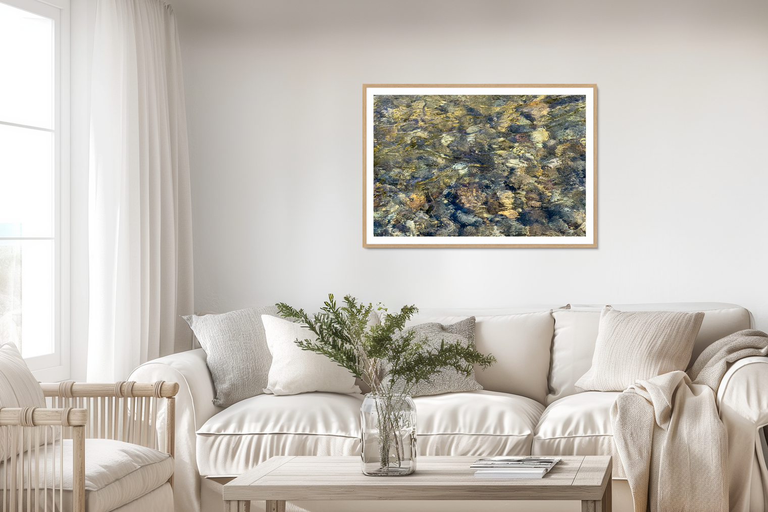 River Rock Clarity_fine art framed print_by Jules Frazier_Living room with a white sofa, coffee table, and abstract painting on the wall.