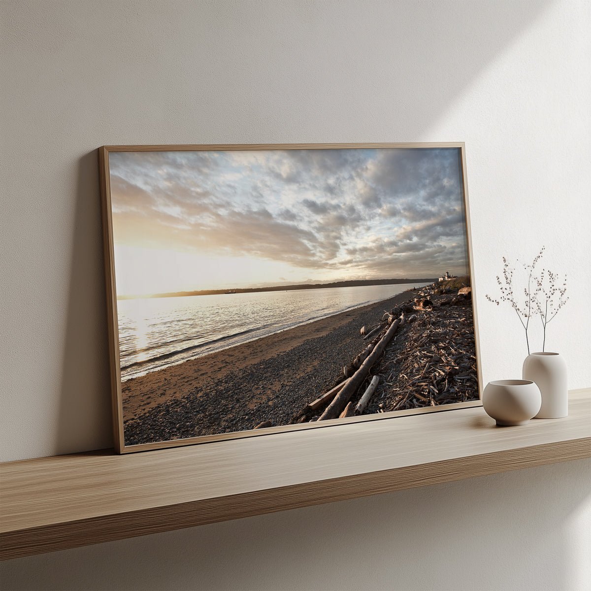 Discovery Sunset fine art print in a natural wood frame leaning on a shelf, by Jules Frazier